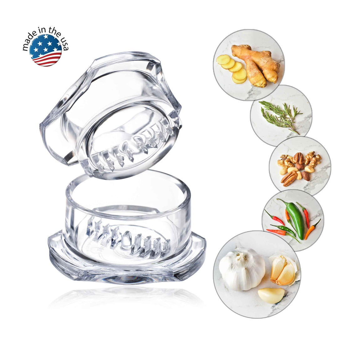 Clear Garlic Twister unit with ginger, rosemary, mixed nuts, mixed peppers, and garlic shown. Made in the USA logo.